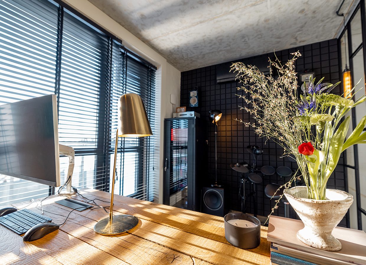 Home office interior in modern, natural style with loft glass wall and sunshine