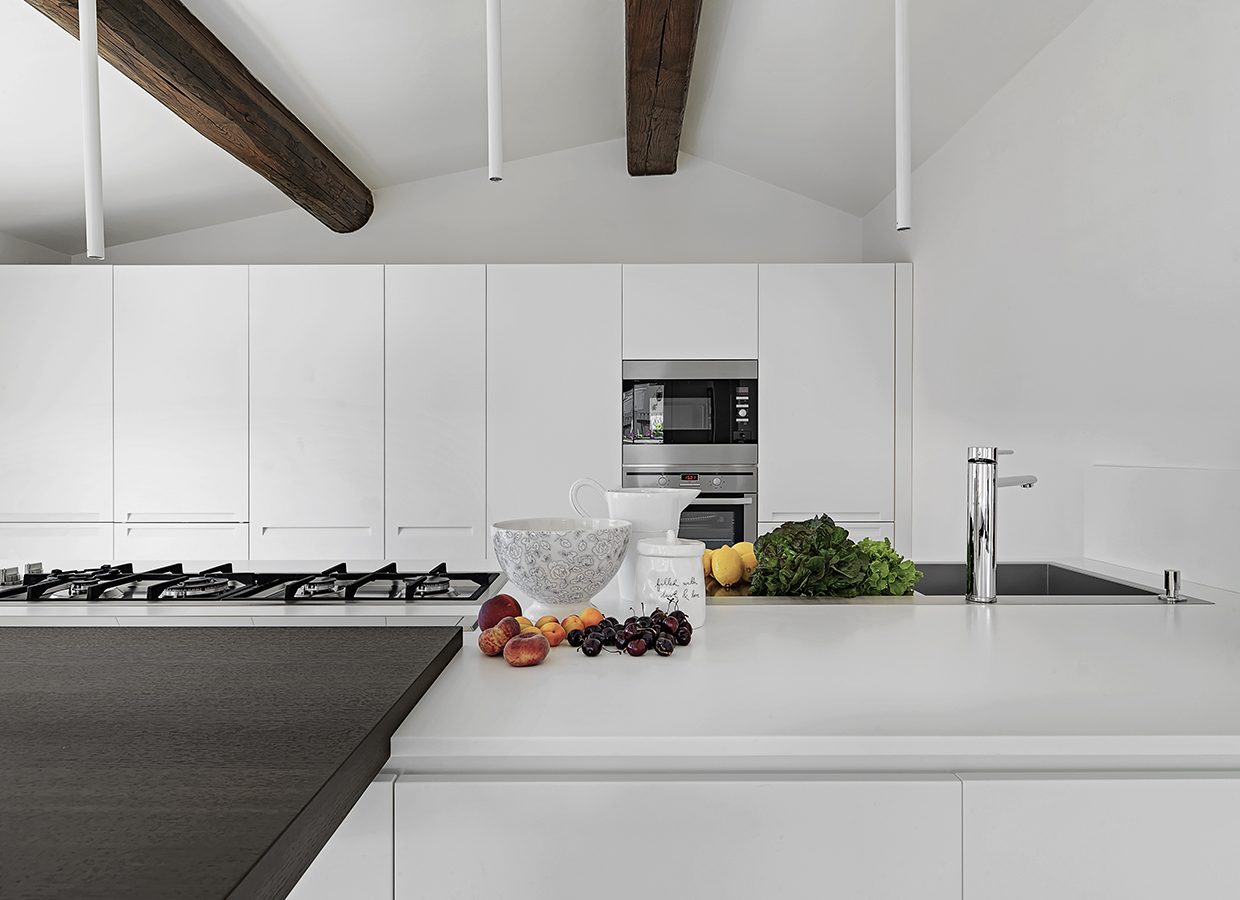 close-up of some furits and vegetables  on the kitchen counter in the modern kitchen in the attic room